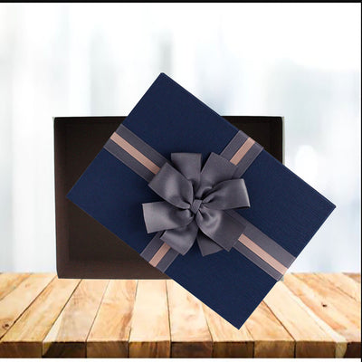 Blue lid Gift Boxes made from strong, rigid, longlisting cardboard Material. Box has elegant cream design with a chocolate brown interior, beautifully finished with a textured lid and a two tone brown ribbon bow. No assembling required.